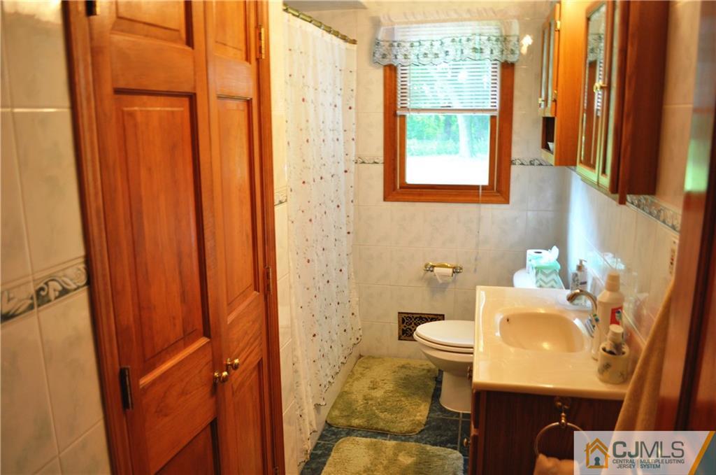547 Ridge Road Monmouth Junction, NJ 08852 - Photo 17 of 25 a bathroom with a sink toilet and shower