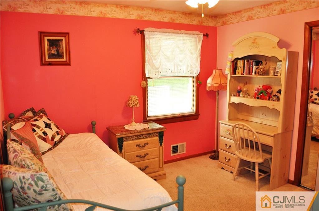 547 Ridge Road Monmouth Junction, NJ 08852 - Photo 19 of 25 a bedroom with a bed and a window