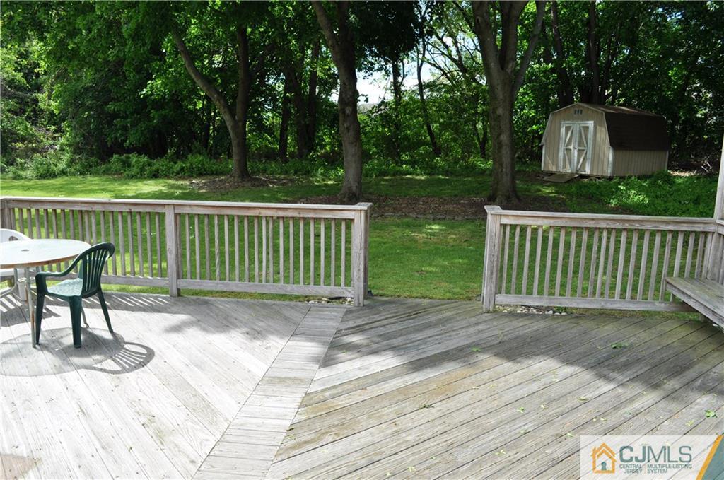 547 Ridge Road Monmouth Junction, NJ 08852 - Photo 23 of 25 a view of a chair and table on the wooden floor