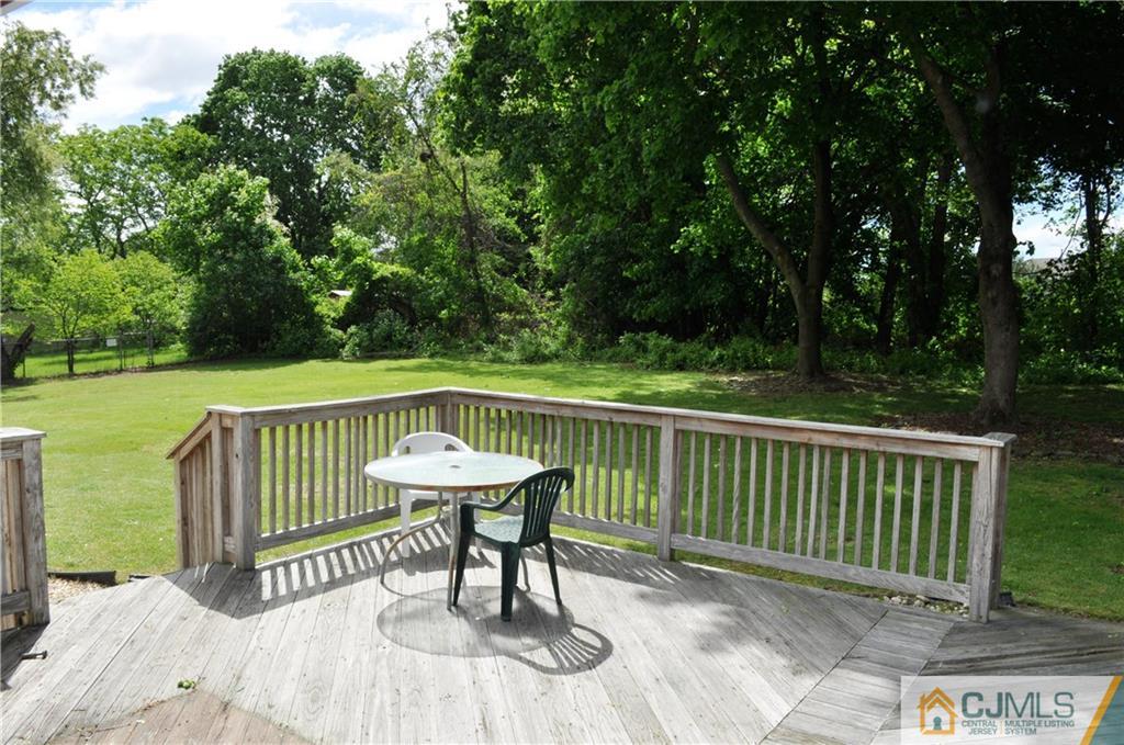 547 Ridge Road Monmouth Junction, NJ 08852 - Photo 24 of 25 a view of a table and chairs on the roof deck