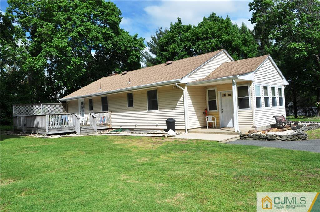 547 Ridge Road Monmouth Junction, NJ 08852 - Photo 5 of 25 a front view of a house with a yard and sitting area