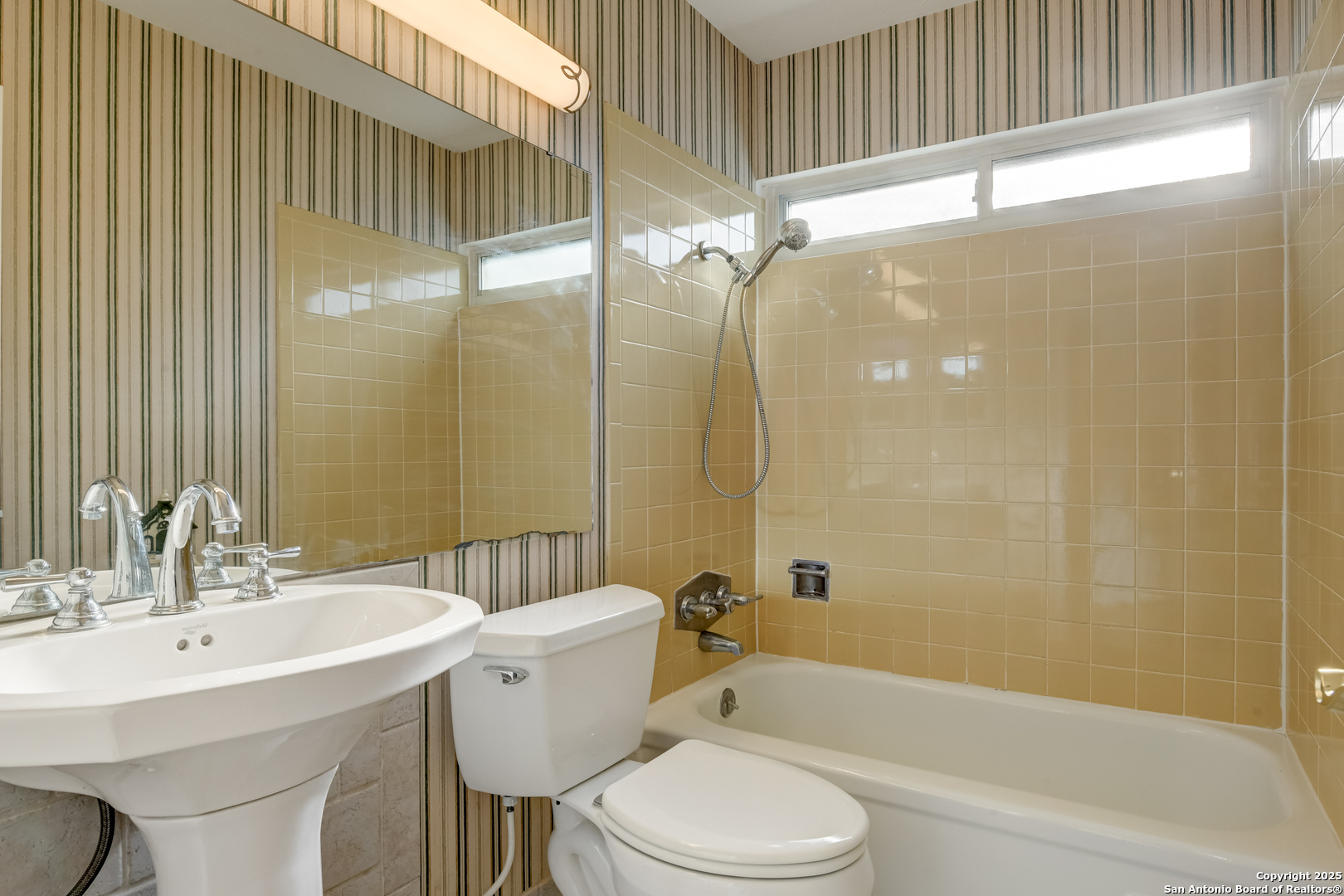 12401 Trailing Oaks Street Live Oak, TX 78233 - Photo 22 of 31 a bathroom with a sink toilet and shower
