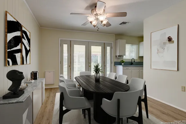 a view of a dining room with furniture and chandelier