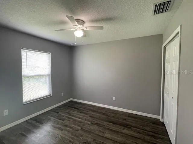 a bathroom with a toilet a sink a mirror and a bathtub