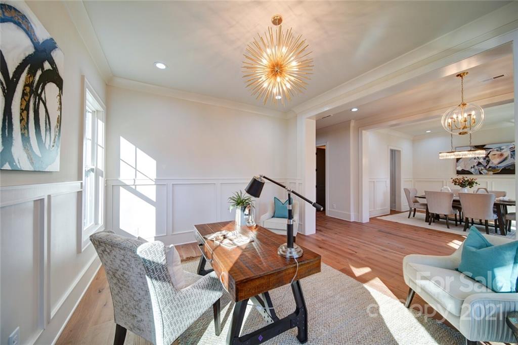 3017 McLendon Road Matthews, NC 28104 - Photo 11 of 47 a living room with furniture a dining table and a large window