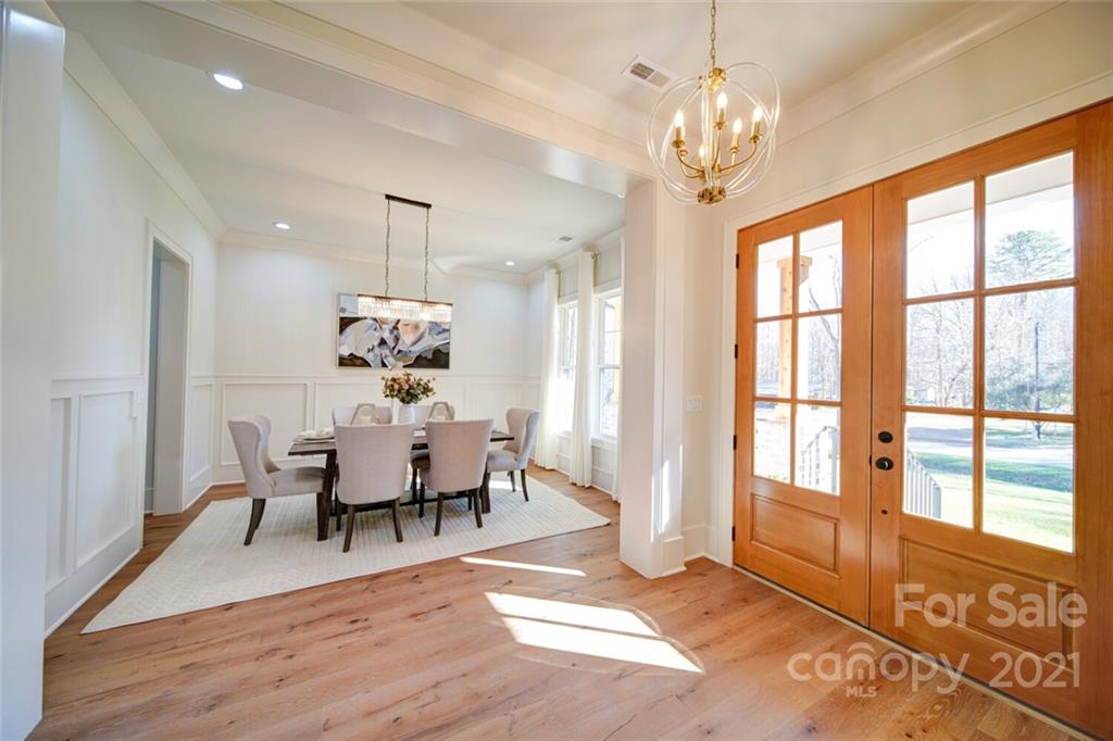 3017 McLendon Road Matthews, NC 28104 - Photo 12 of 47 a living room with furniture and a chandelier