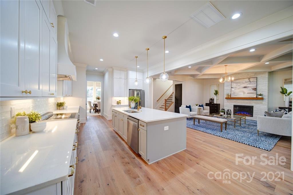 3017 McLendon Road Matthews, NC 28104 - Photo 18 of 47 a living room with furniture wooden floor and a kitchen view