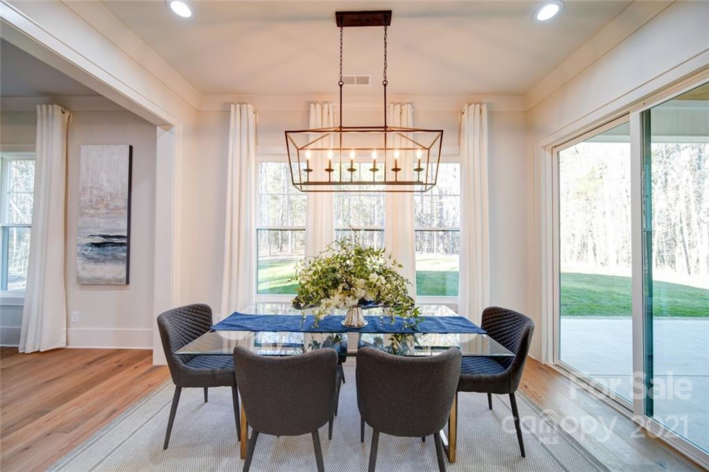3017 McLendon Road Matthews, NC 28104 - Photo 22 of 47 a view of a dining room with furniture window and outside view