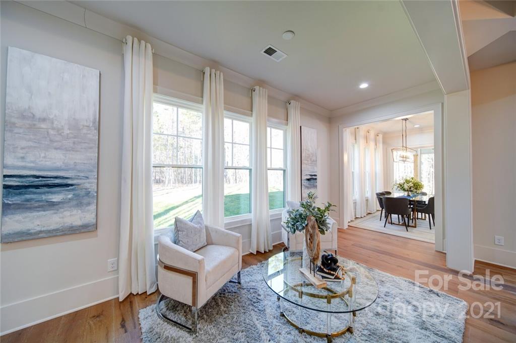3017 McLendon Road Matthews, NC 28104 - Photo 23 of 47 a living room with couch and a potted plant