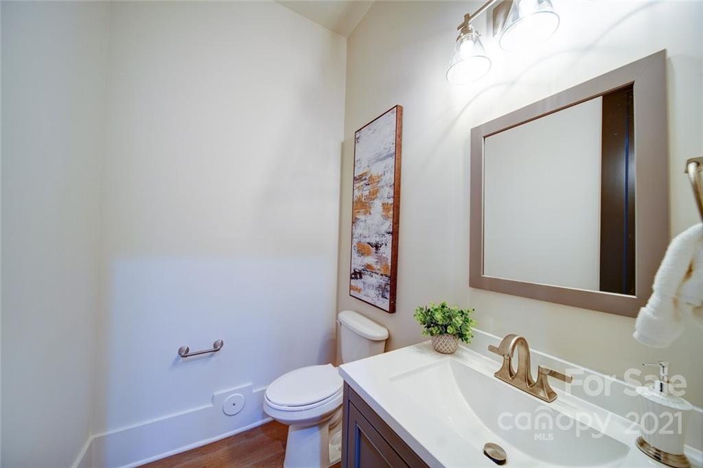 3017 McLendon Road Matthews, NC 28104 - Photo 27 of 47 a bathroom with a sink and a mirror