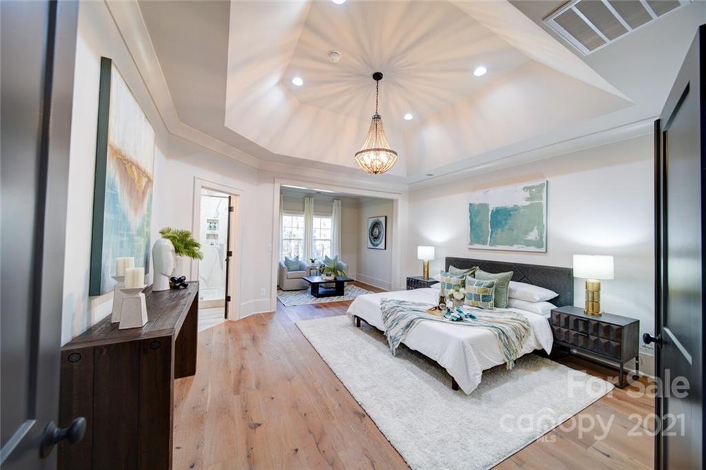 3017 McLendon Road Matthews, NC 28104 - Photo 31 of 47 a bedroom with bed and wooden floor