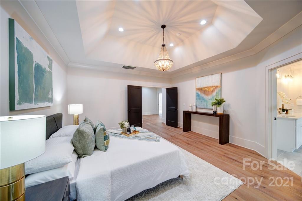 3017 McLendon Road Matthews, NC 28104 - Photo 33 of 47 a bedroom with a bed and a large mirror on the dresser