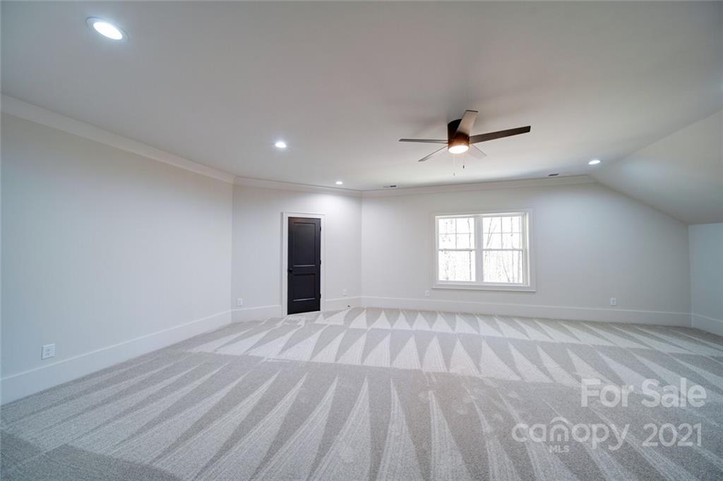 3017 McLendon Road Matthews, NC 28104 - Photo 38 of 47 wooden floor in an empty room with a window