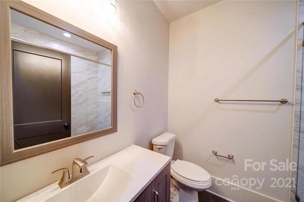3017 McLendon Road Matthews, NC 28104 - Photo 40 of 47 a bathroom with a sink a toilet and shower