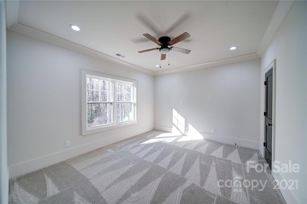 3017 McLendon Road Matthews, NC 28104 - Photo 42 of 47 a view of empty room with wooden floor and fan
