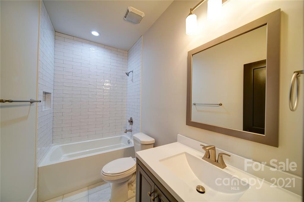 3017 McLendon Road Matthews, NC 28104 - Photo 47 of 47 a bathroom with a sink a toilet and shower