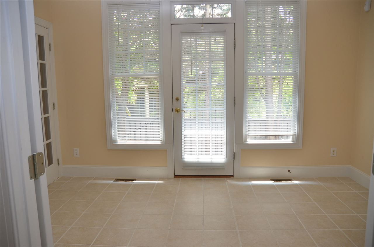 1843 Middlebrook Drive Raleigh, NC 27615 - Photo 11 of 13 Sun Room leads to private back yard with brick patio for entertaining. Sun Room