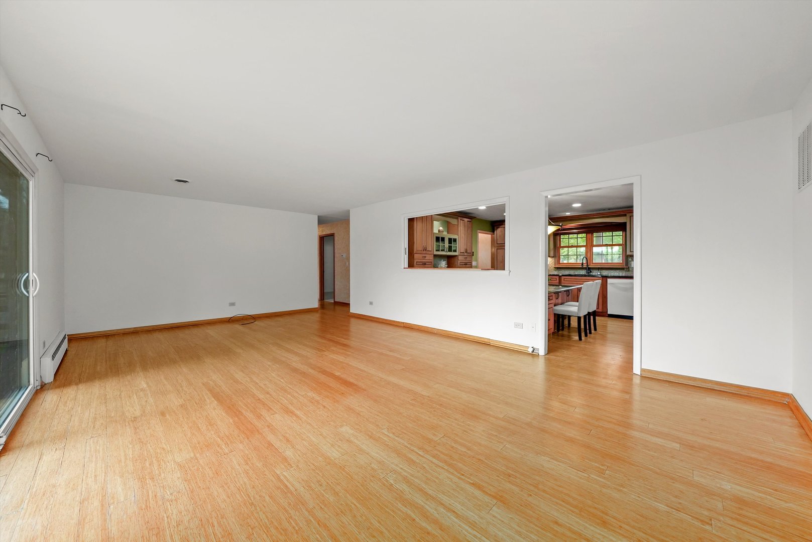 1406 Lincoln Road McHenry, IL 60051 - Photo 16 of 39 an empty room with wooden floor and windows