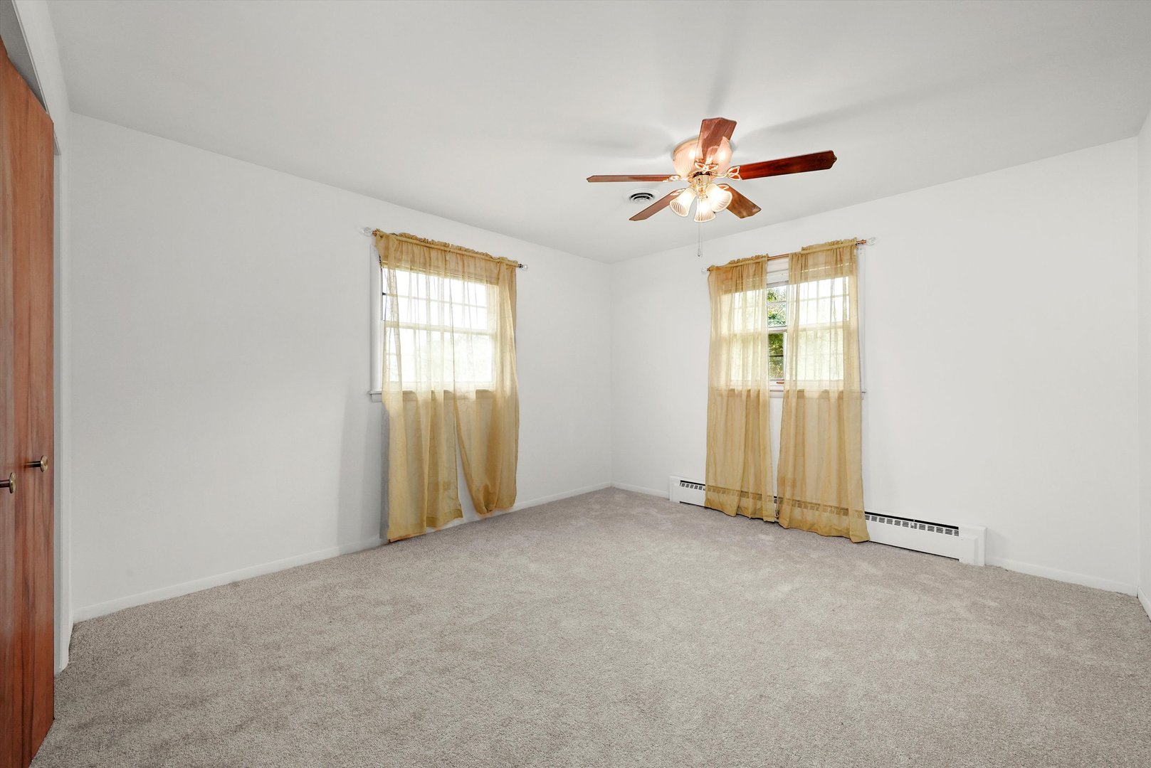 1406 Lincoln Road McHenry, IL 60051 - Photo 20 of 39 an empty room with windows and fan