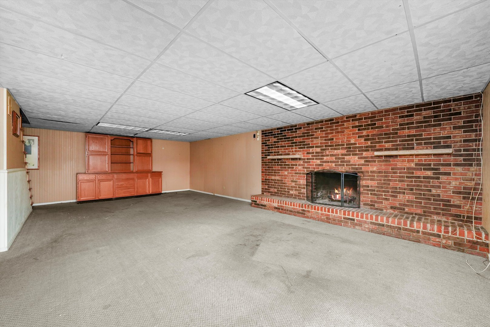 1406 Lincoln Road McHenry, IL 60051 - Photo 26 of 39 a view of an empty room with a fireplace