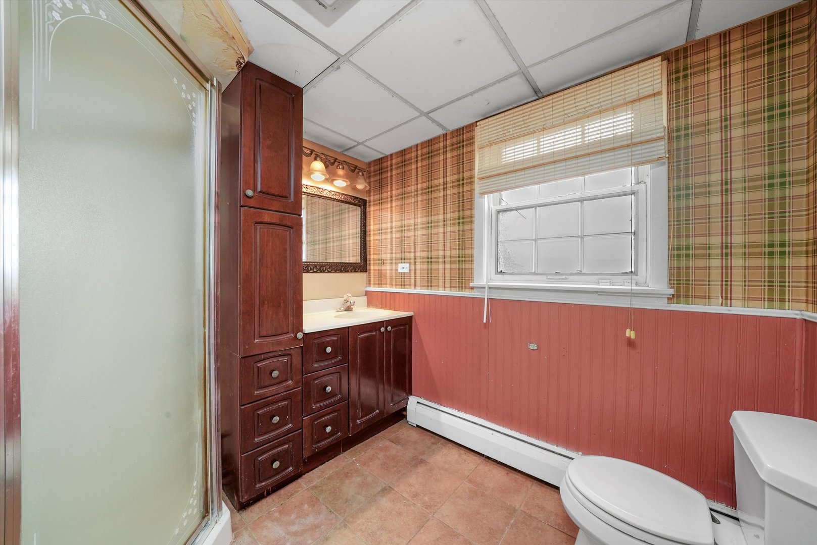 1406 Lincoln Road McHenry, IL 60051 - Photo 31 of 39 a bathroom with a sink a toilet and mirror