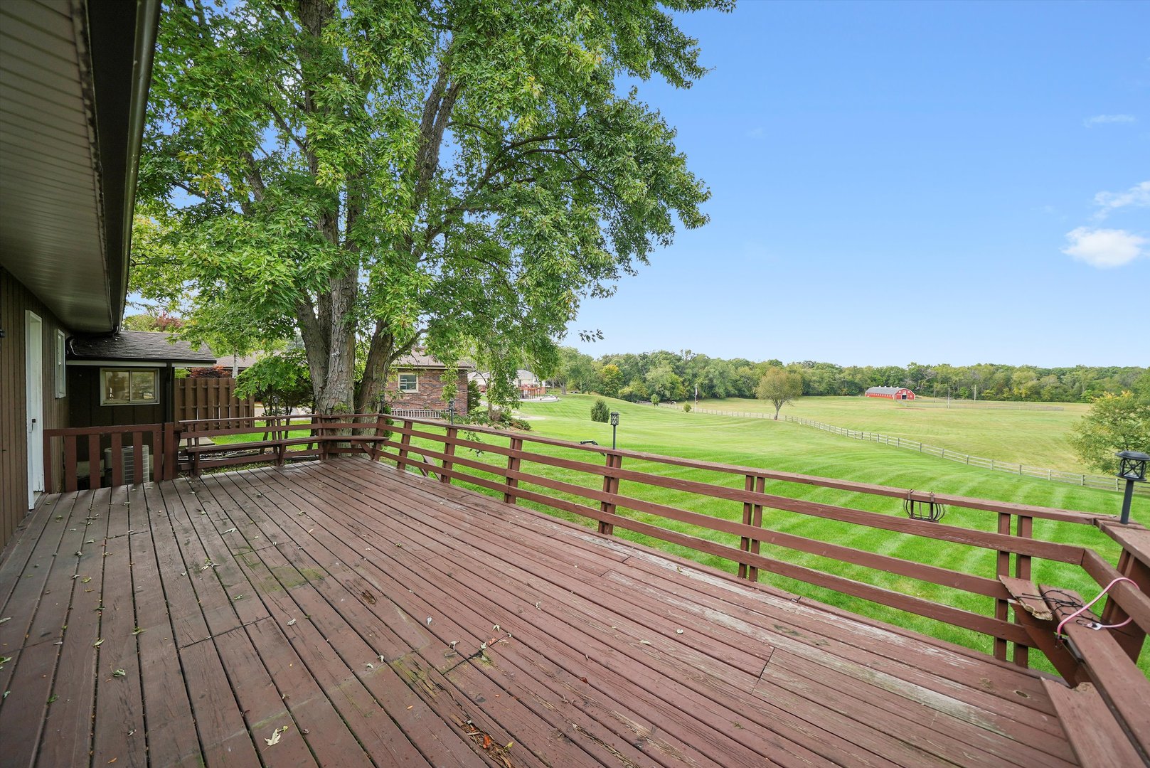 1406 Lincoln Road McHenry, IL 60051 - Photo 34 of 39 a view of a deck with chairs and wooden floor