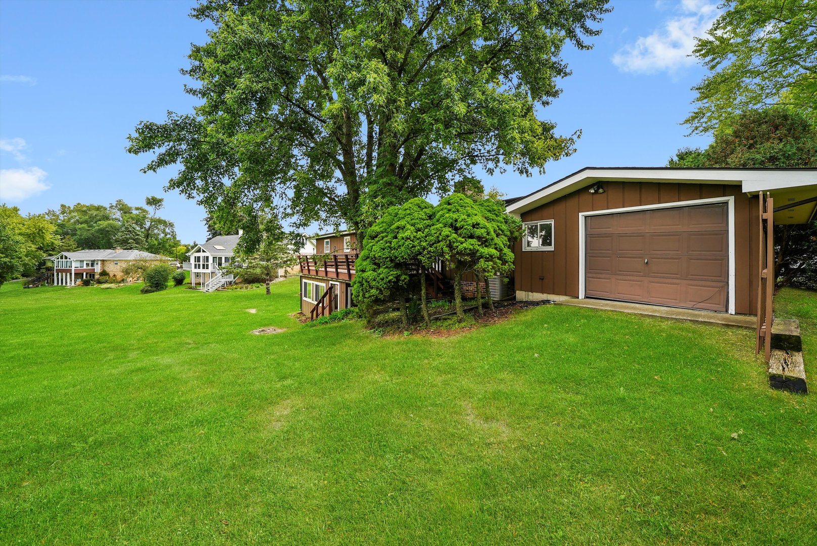 1406 Lincoln Road McHenry, IL 60051 - Photo 36 of 39 a front view of a house with a garden