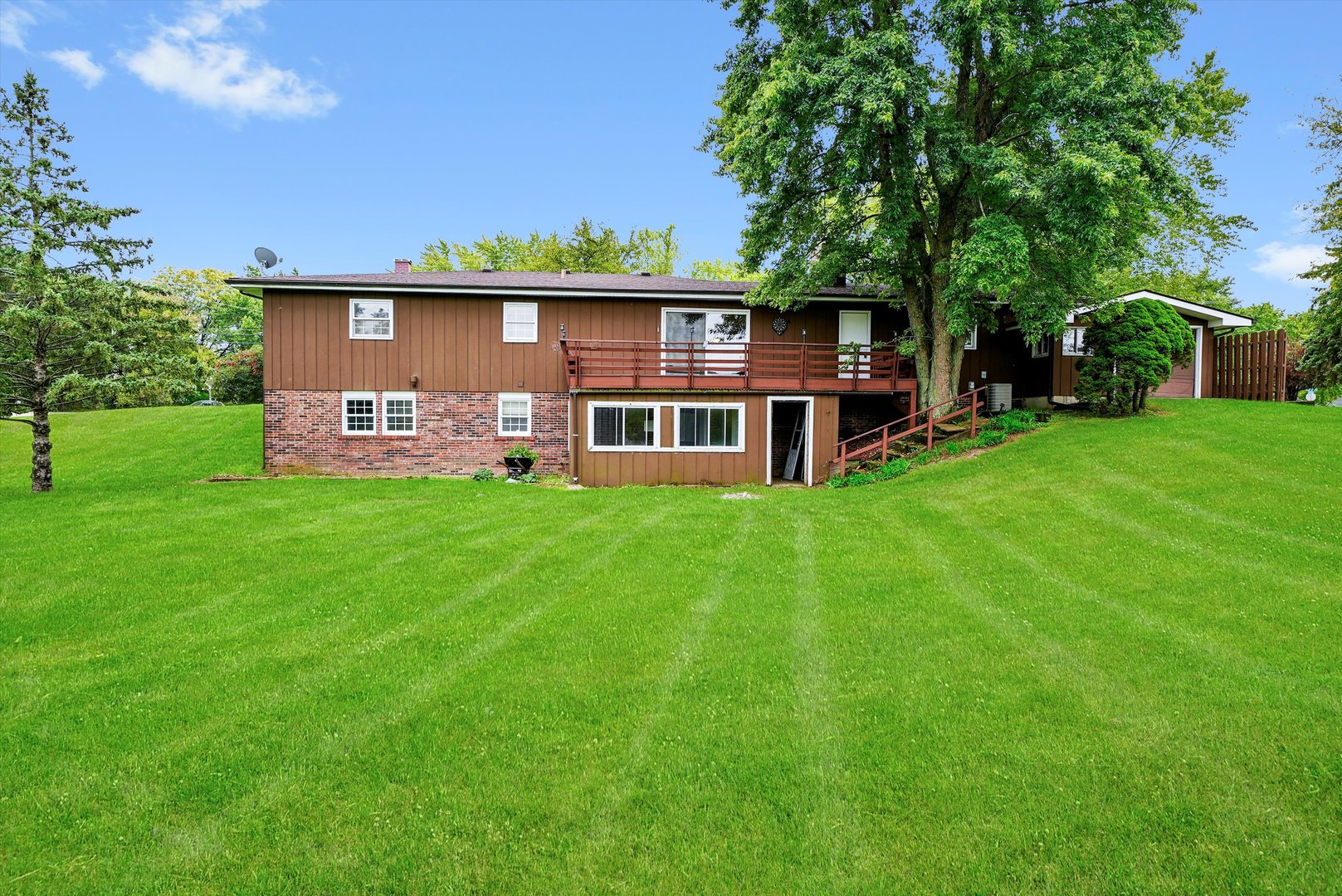 1406 Lincoln Road McHenry, IL 60051 - Photo 7 of 39 a view of a house with a yard porch and sitting area