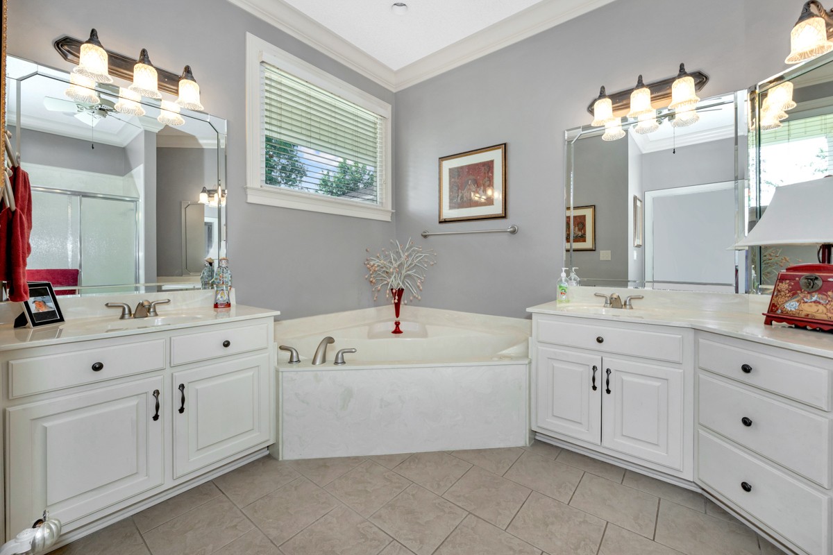 21 Meeting House Road Ardmore, TN 38449 - Photo 11 of 62 a spacious bathroom with a double vanity sink mirror and bathtub