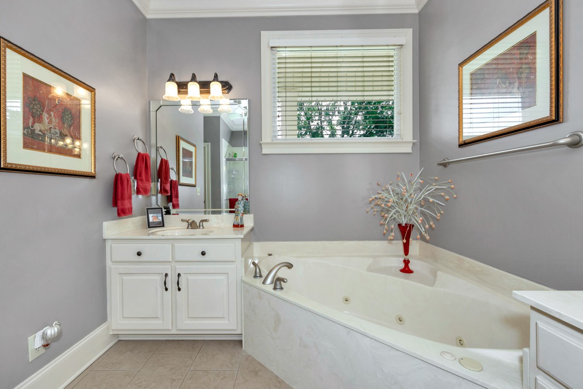 21 Meeting House Road Ardmore, TN 38449 - Photo 12 of 62 a bathroom with a bathtub sink and mirror