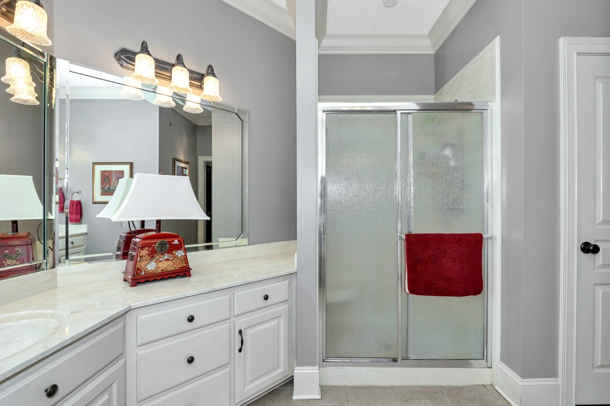 21 Meeting House Road Ardmore, TN 38449 - Photo 13 of 62 a bathroom with a sink vanity and mirror
