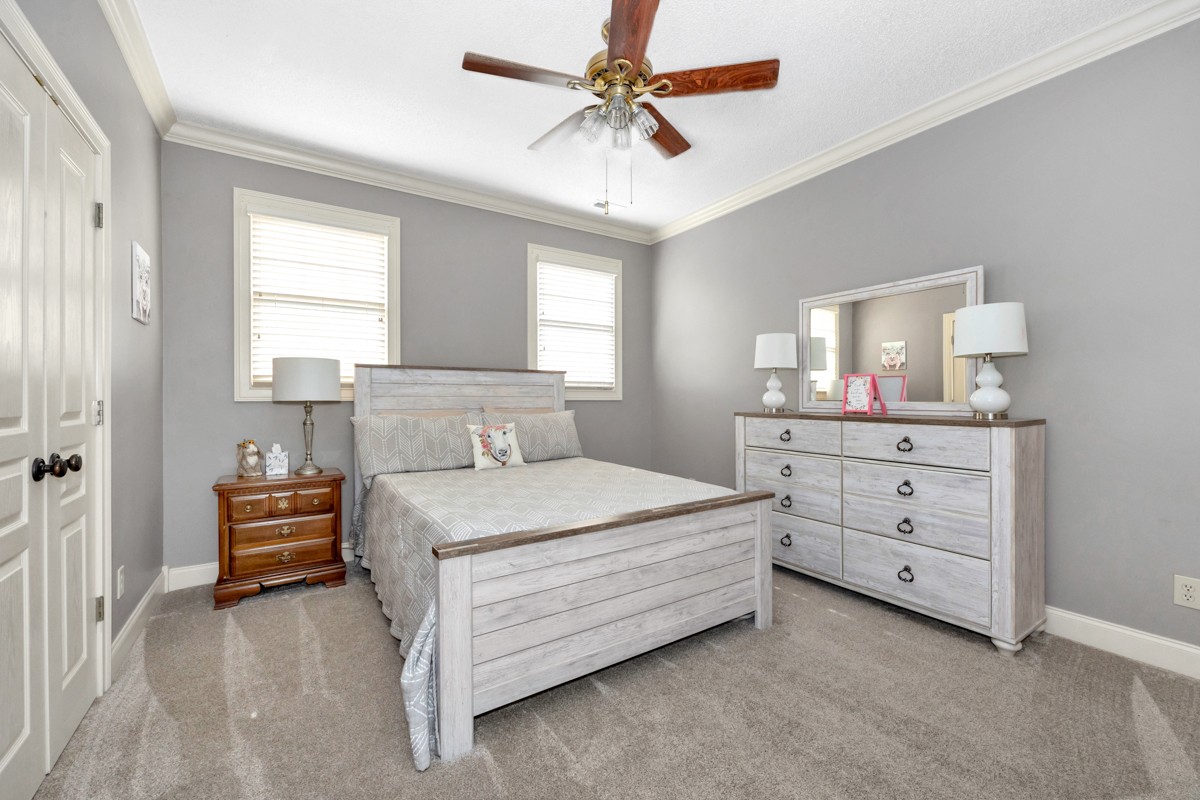 21 Meeting House Road Ardmore, TN 38449 - Photo 24 of 62 a bedroom with a bed and a dresser