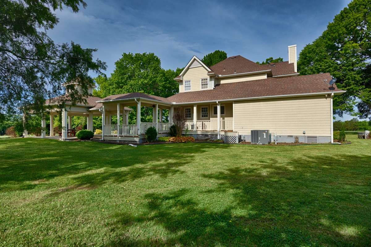 21 Meeting House Road Ardmore, TN 38449 - Photo 41 of 62 a front view of a house with a garden