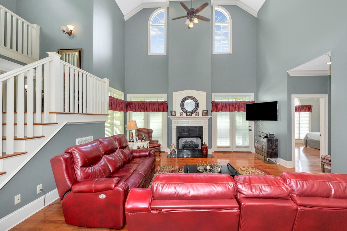 21 Meeting House Road Ardmore, TN 38449 - Photo 5 of 62 a living room with furniture a flat screen tv and a fireplace
