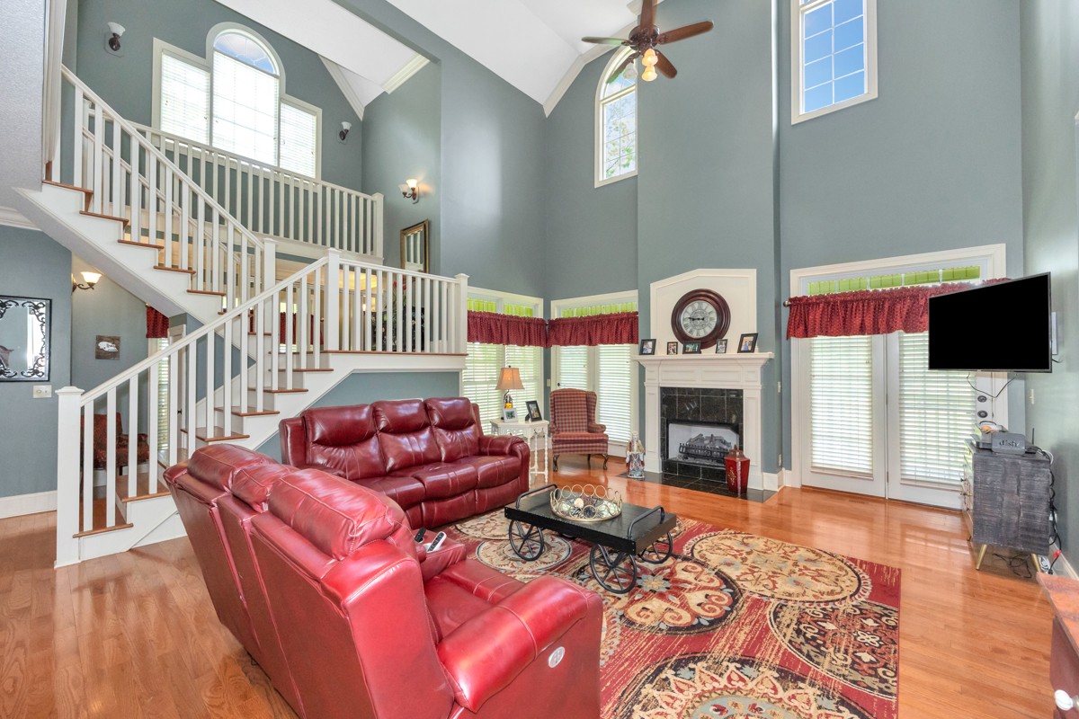 21 Meeting House Road Ardmore, TN 38449 - Photo 6 of 62 a living room with furniture a fireplace and a flat screen tv