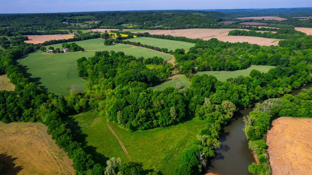21 Meeting House Road Ardmore, TN 38449 - Photo 62 of 62 an aerial view of green landscape with trees houses and lake view
