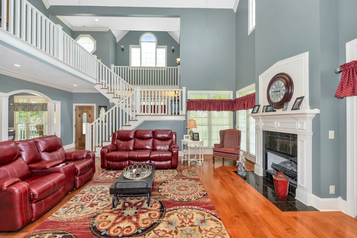 21 Meeting House Road Ardmore, TN 38449 - Photo 7 of 62 a living room with furniture a fireplace and a large window