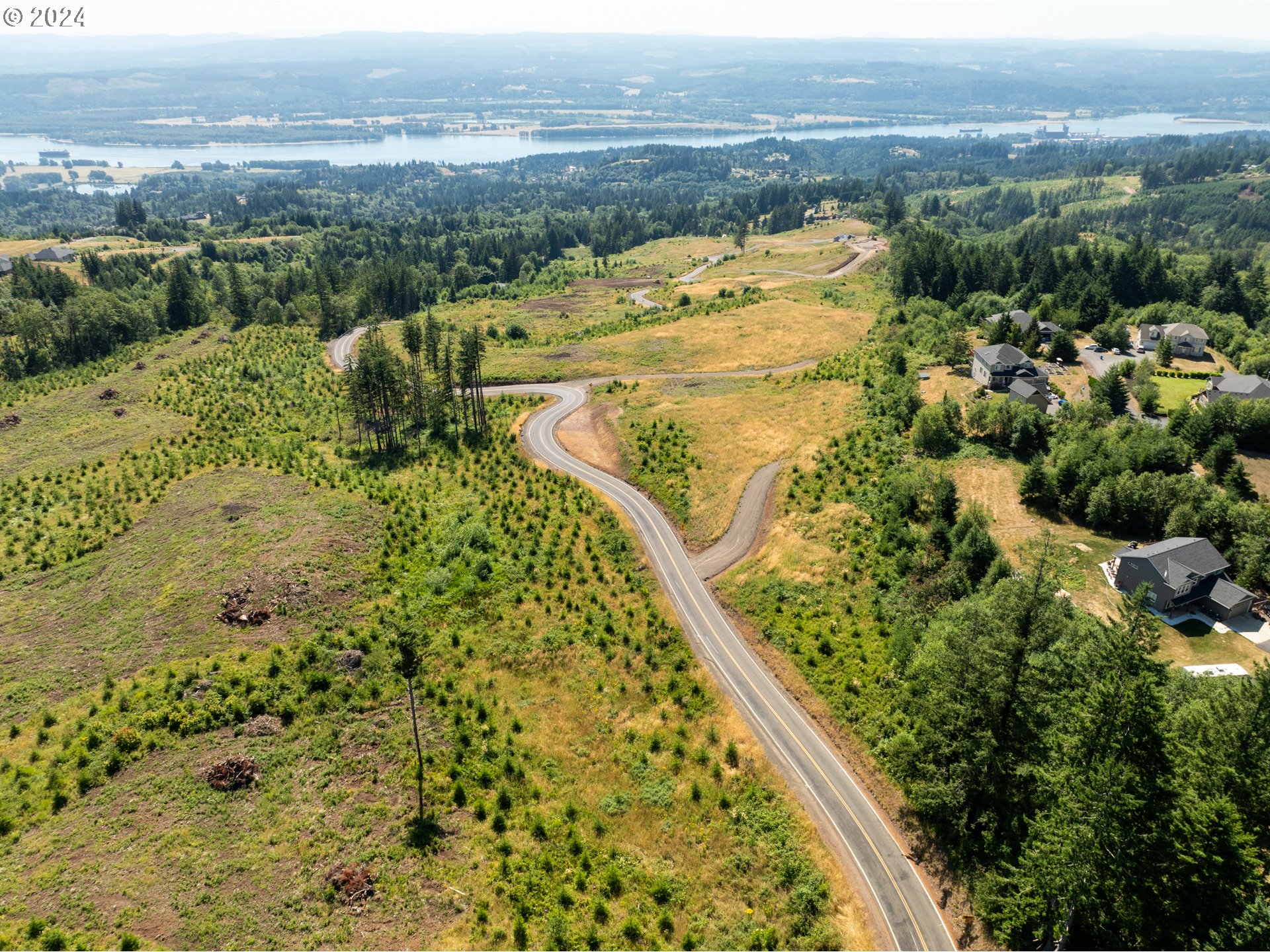 0 Green Mountain Road, Unit 2 Kalama, WA 98625 - Photo 6 of 12 an aerial view of residential houses with outdoor space