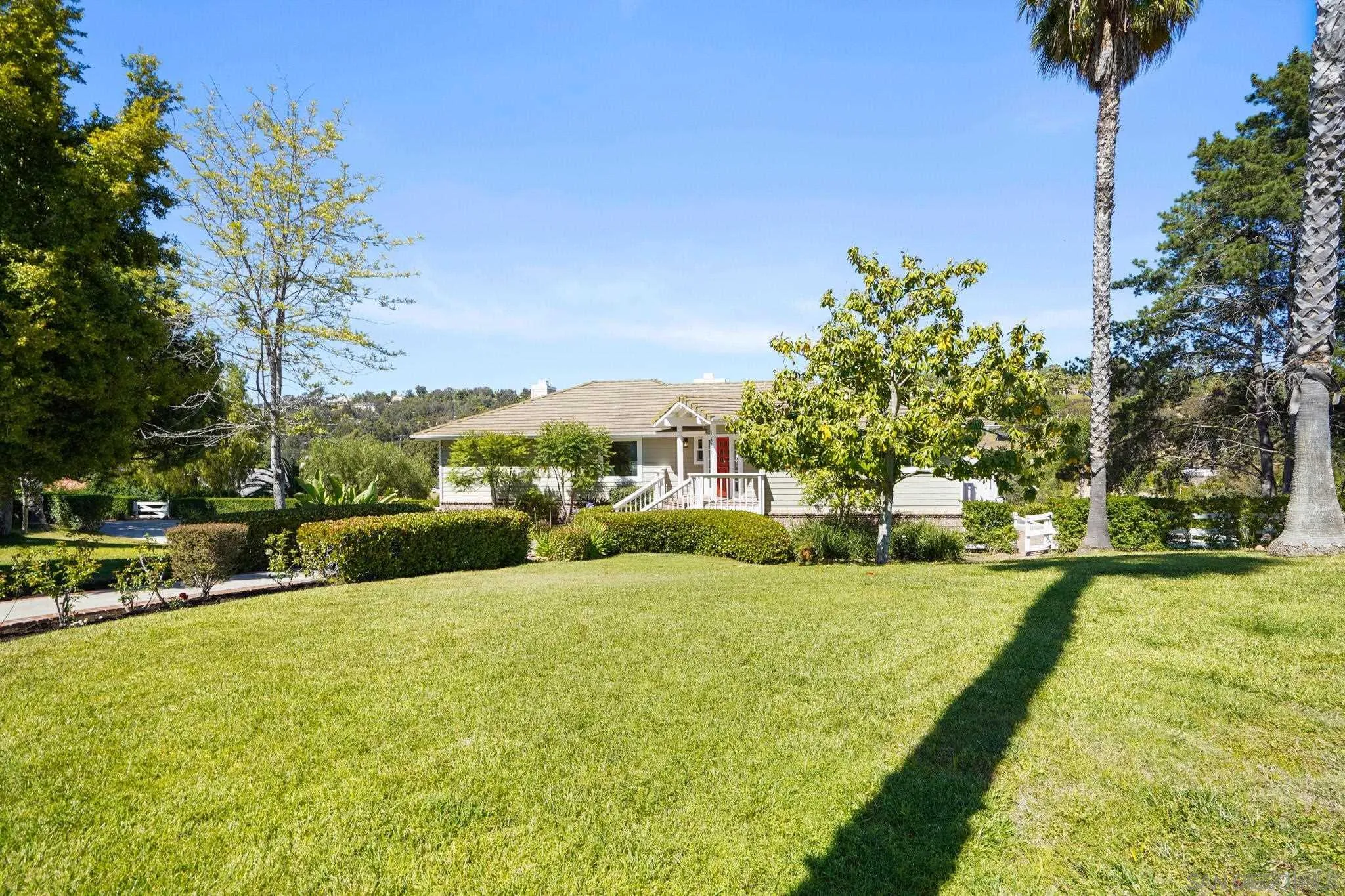 1482 Rancho Encinitas Drive Encinitas, CA 92024 - Photo 19 of 75 a view of swimming pool with outdoor seating and trees in the background