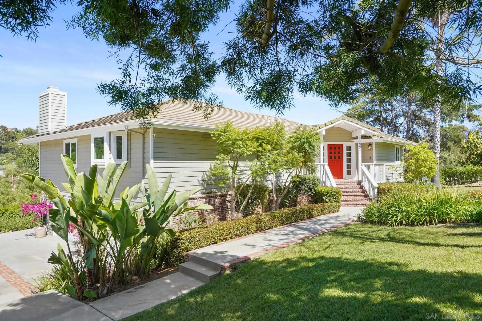1482 Rancho Encinitas Drive Encinitas, CA 92024 - Photo 21 of 75 a front view of a house with a yard