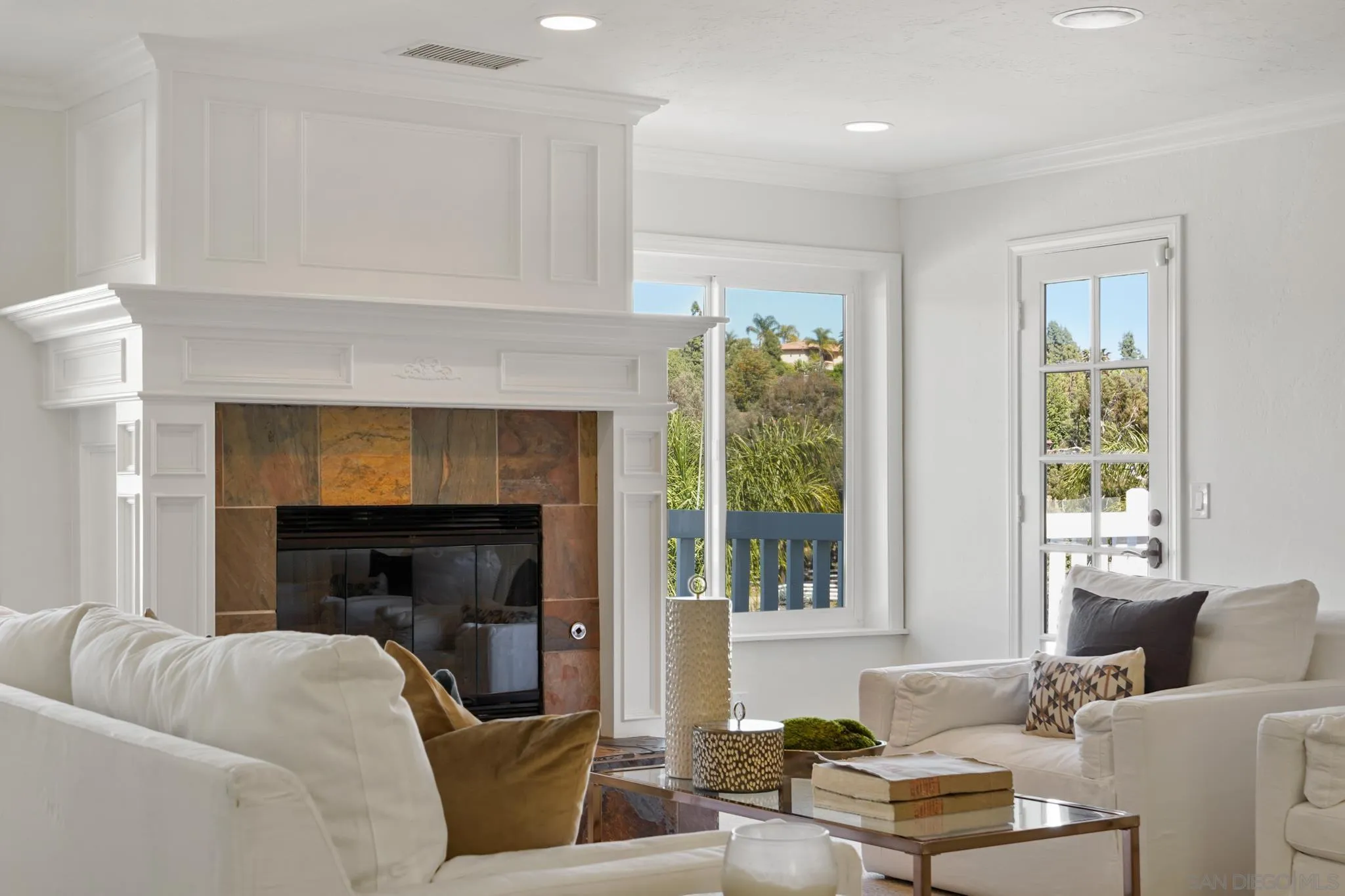 1482 Rancho Encinitas Drive Encinitas, CA 92024 - Photo 29 of 75 a living room with furniture and a fireplace