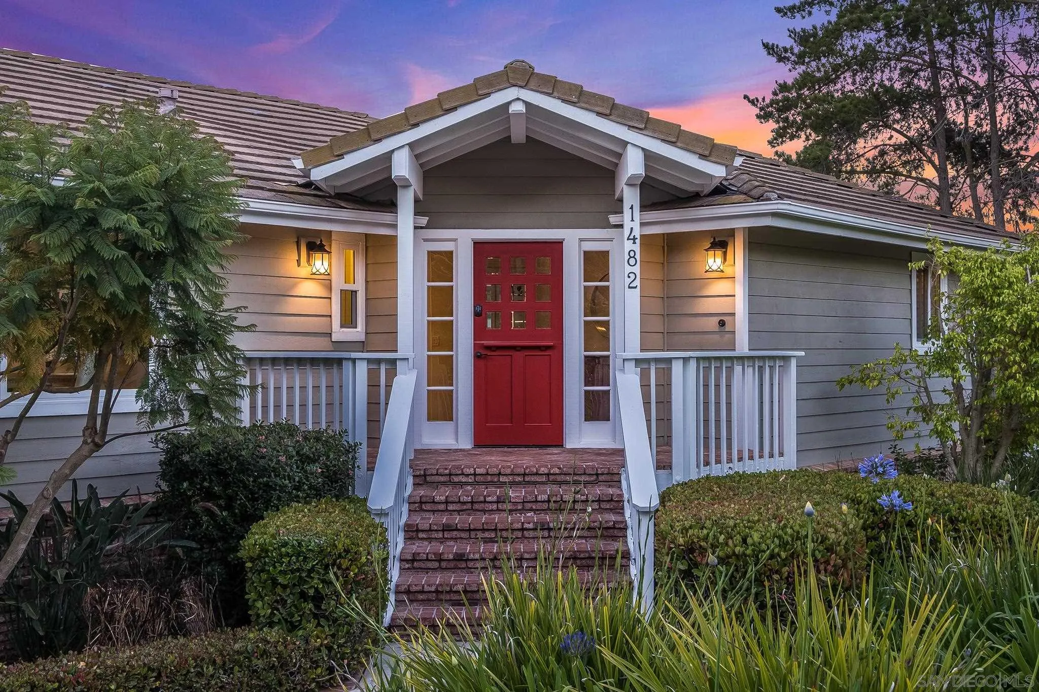 1482 Rancho Encinitas Drive Encinitas, CA 92024 - Photo 3 of 75 a front view of a house with a yard