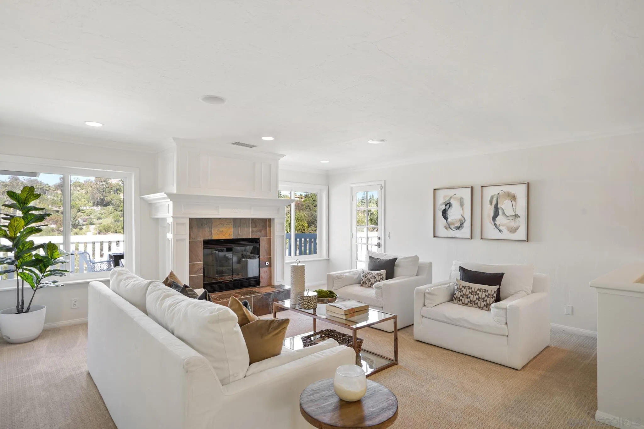 1482 Rancho Encinitas Drive Encinitas, CA 92024 - Photo 31 of 75 a living room with furniture and a fireplace