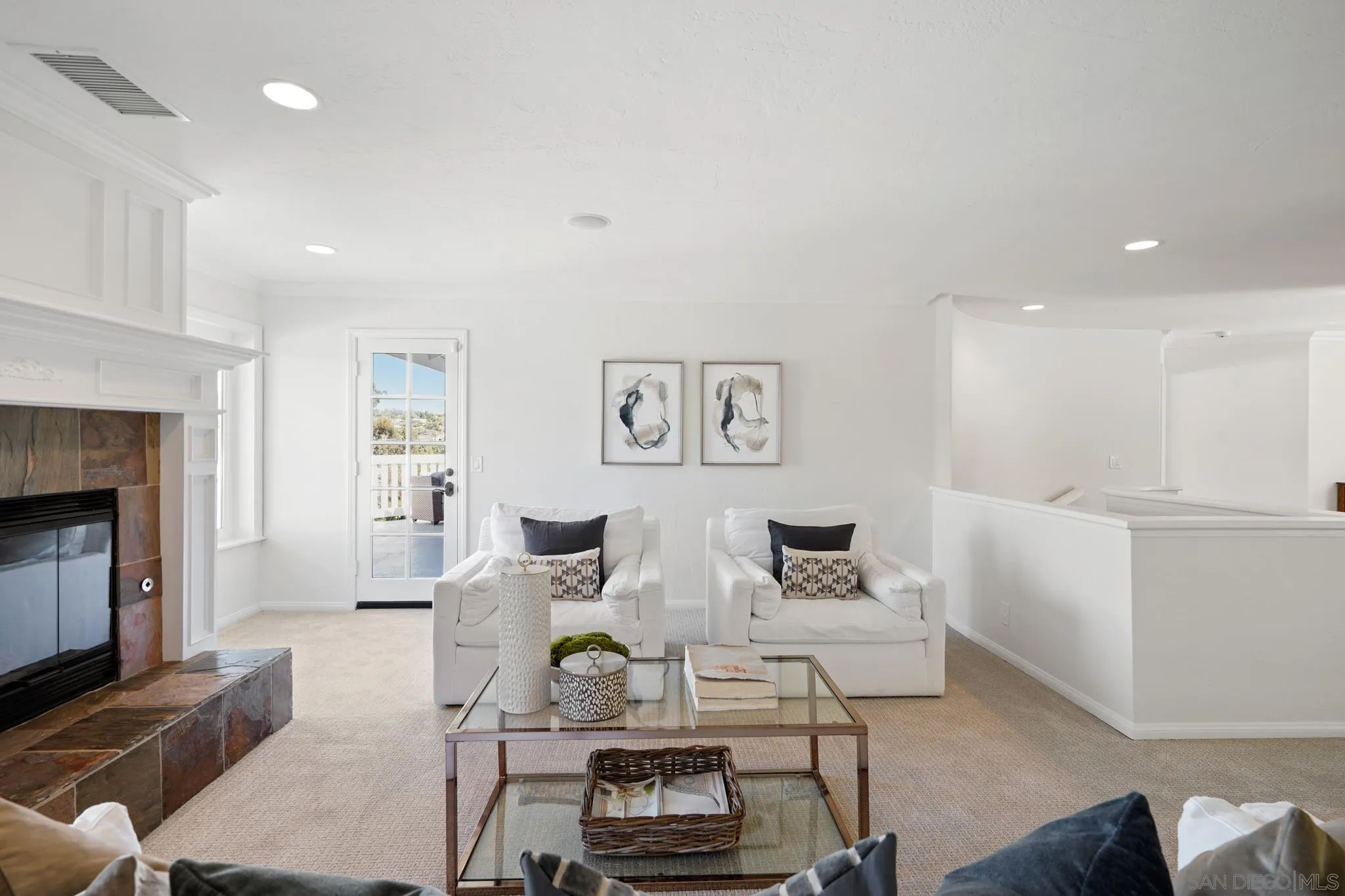 1482 Rancho Encinitas Drive Encinitas, CA 92024 - Photo 32 of 75 a living room with furniture and a fireplace