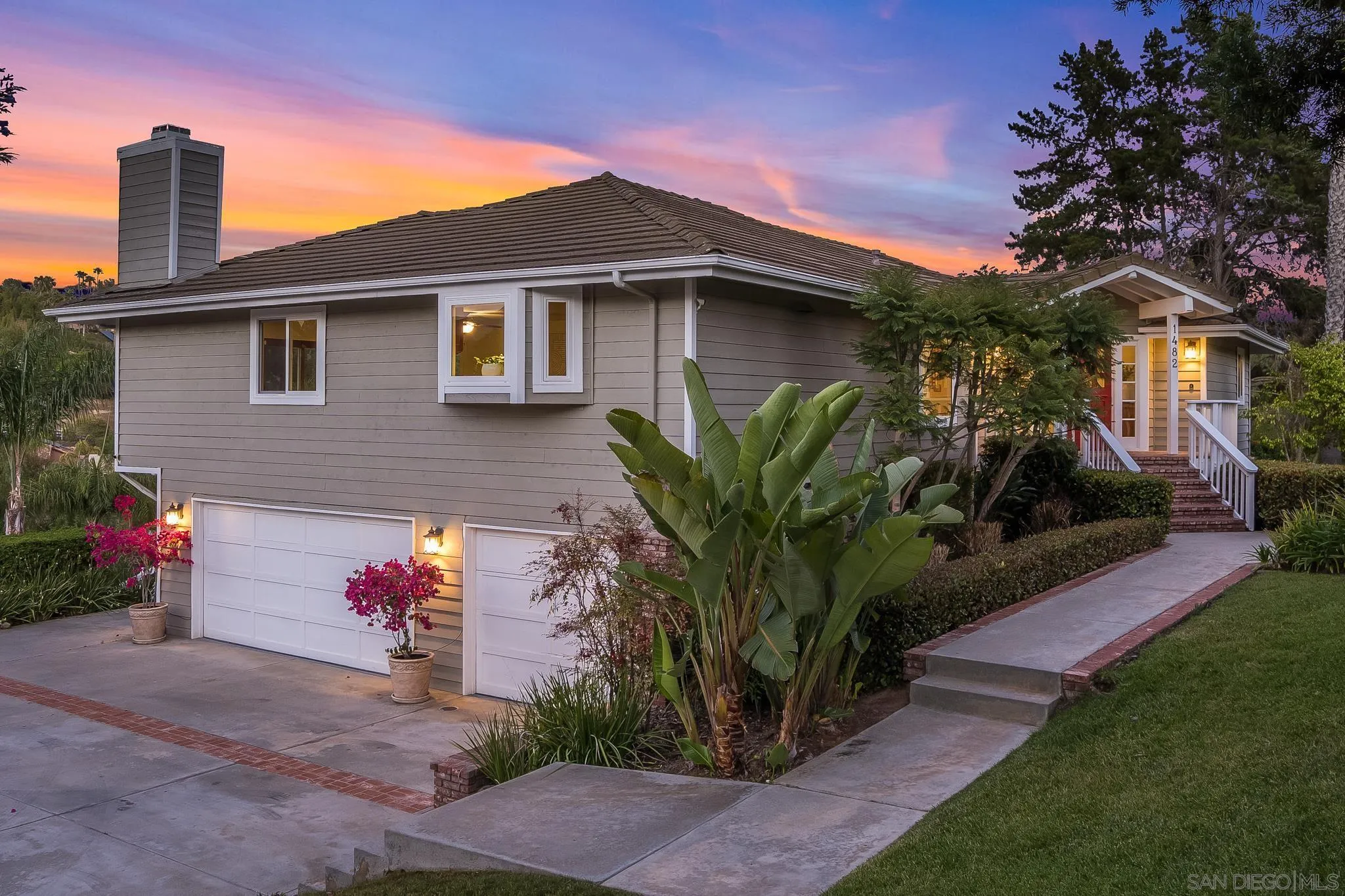 1482 Rancho Encinitas Drive Encinitas, CA 92024 - Photo 4 of 75 a front view of a house with a yard