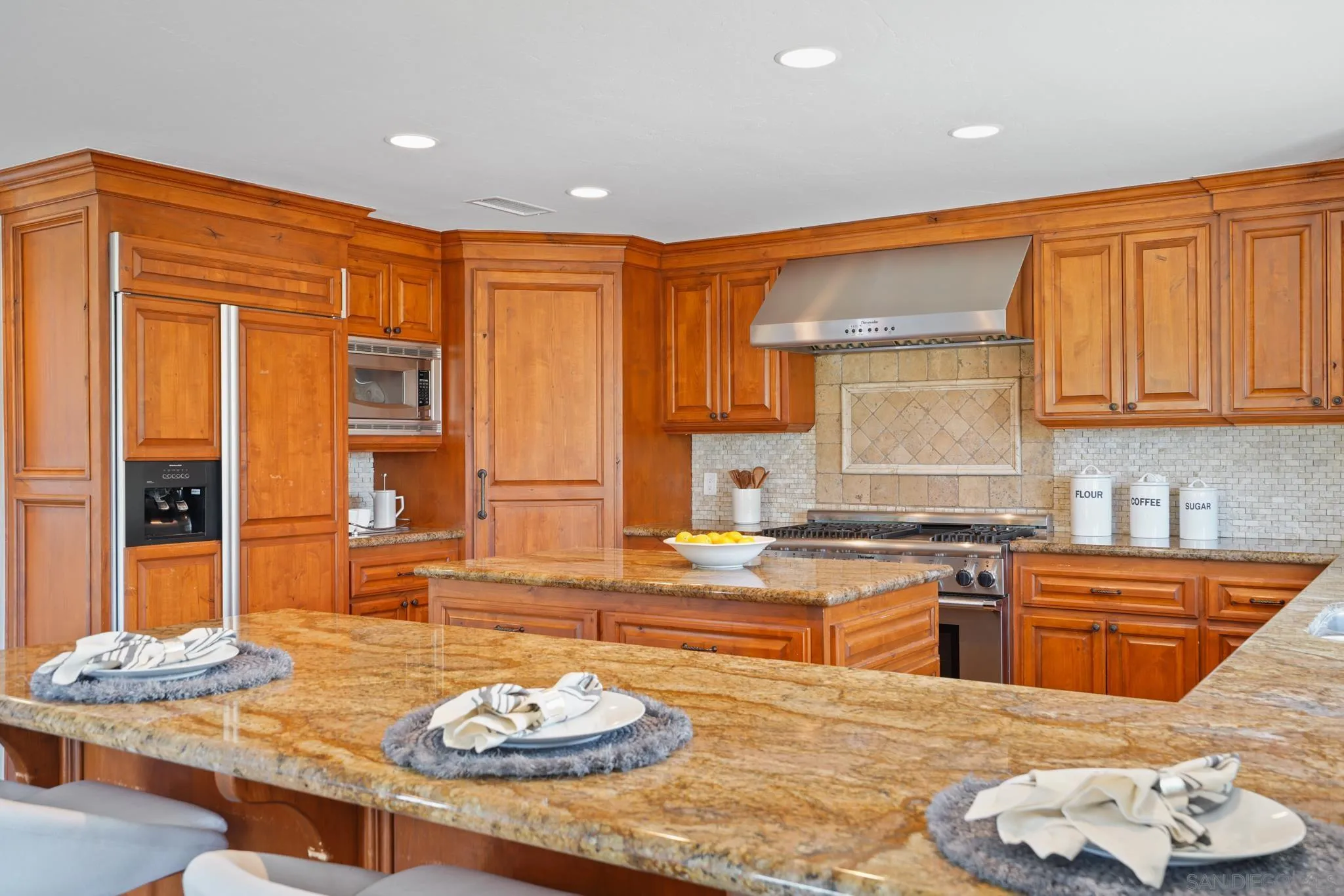 1482 Rancho Encinitas Drive Encinitas, CA 92024 - Photo 44 of 75 a kitchen with stainless steel appliances granite countertop a granite counter tops and a view of living room