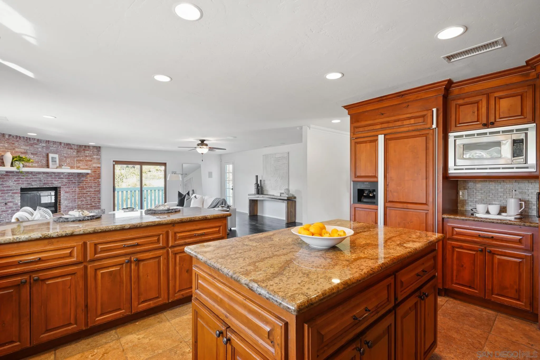 1482 Rancho Encinitas Drive Encinitas, CA 92024 - Photo 46 of 75 a kitchen with granite countertop sink and cabinets