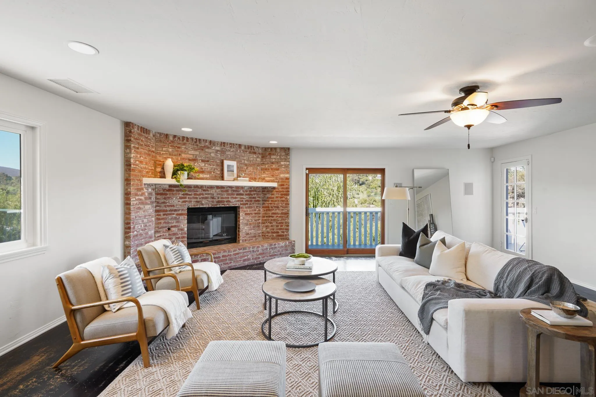 1482 Rancho Encinitas Drive Encinitas, CA 92024 - Photo 50 of 75 a living room with furniture and a fireplace