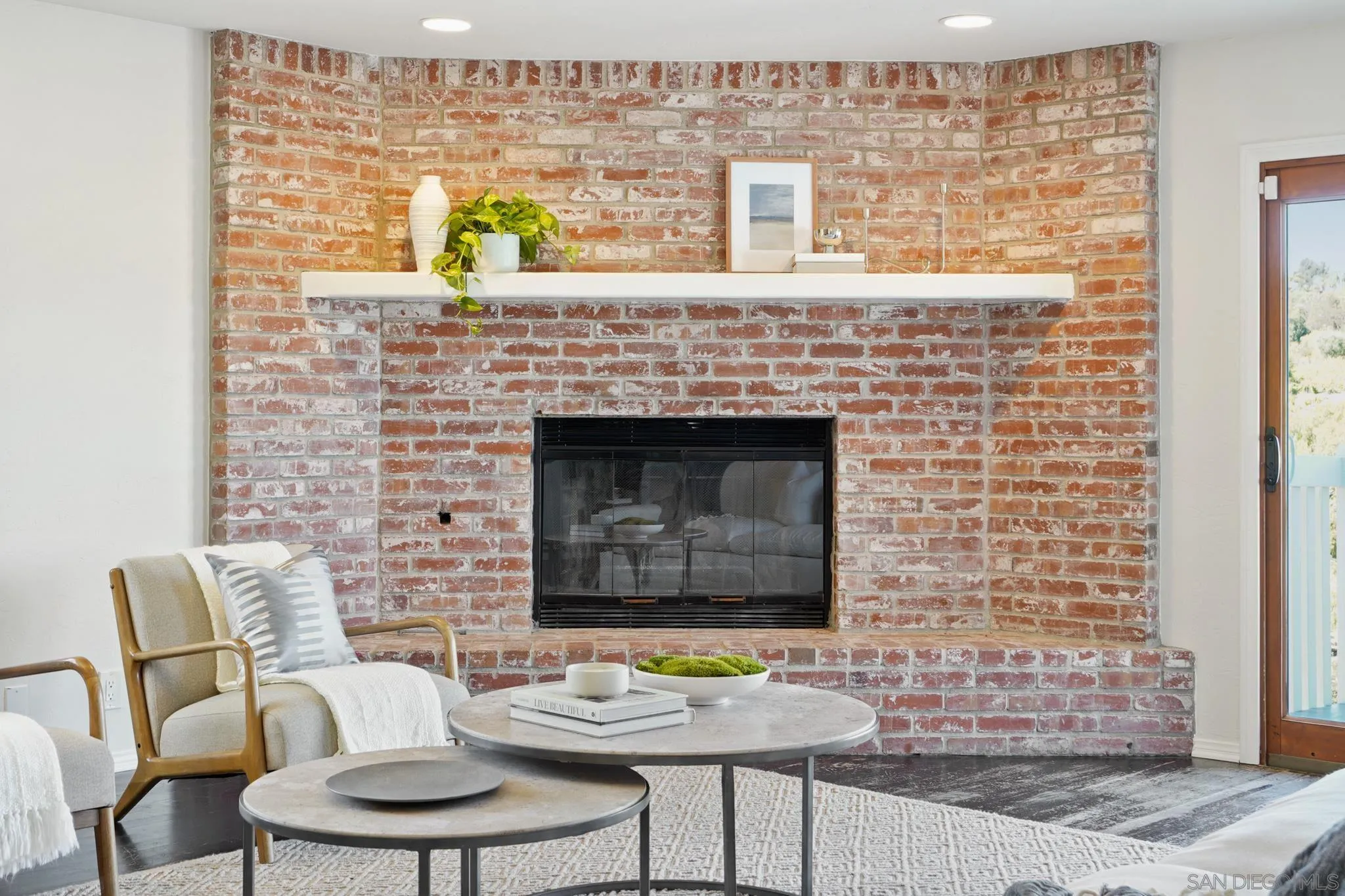 1482 Rancho Encinitas Drive Encinitas, CA 92024 - Photo 53 of 75 a living room with furniture and a fireplace