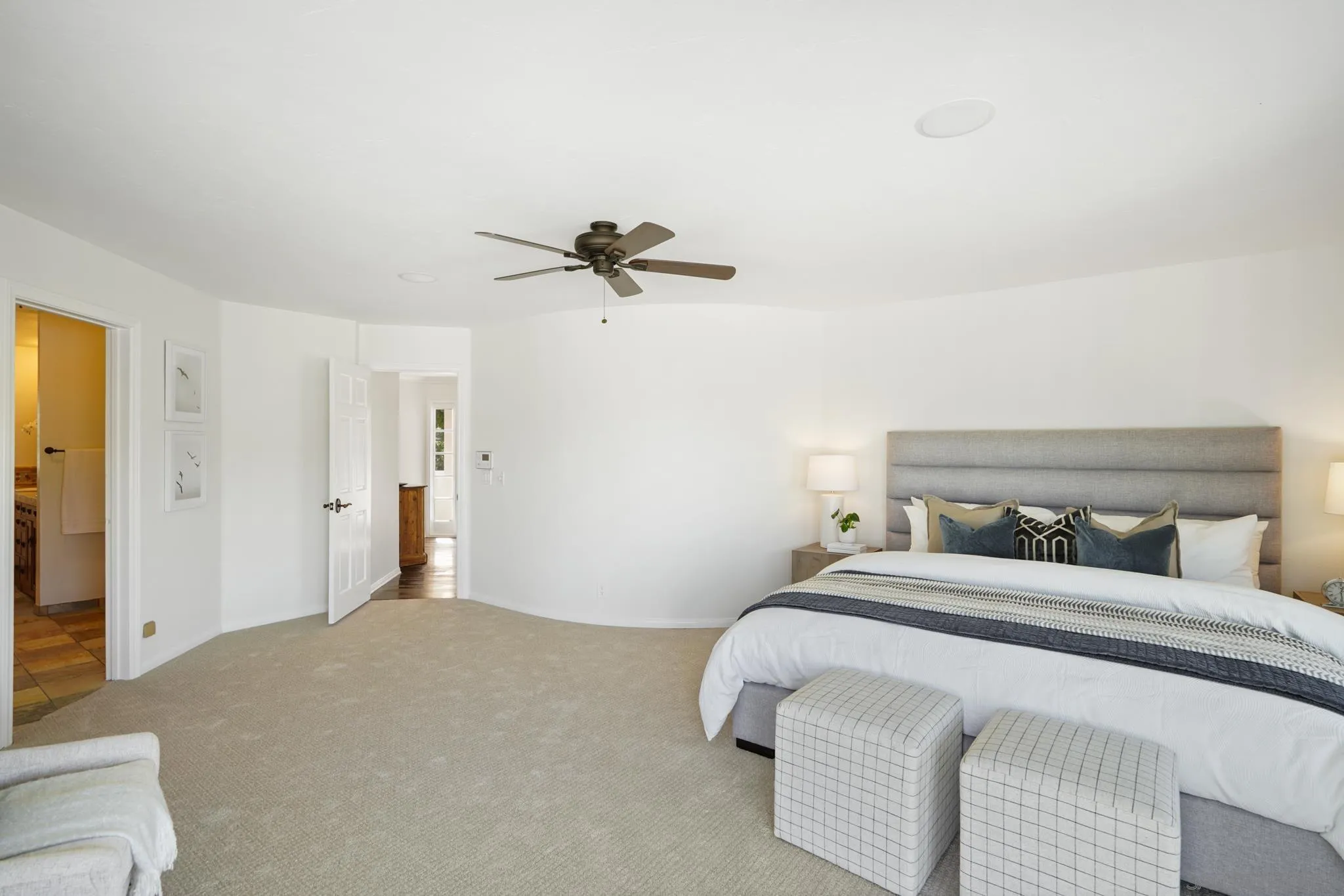 1482 Rancho Encinitas Drive Encinitas, CA 92024 - Photo 58 of 75 a bedroom with a bed and a ceiling fan